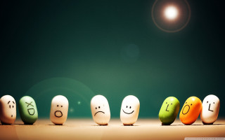 Painted eggs with faces row - expressive free wallpaper