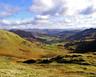 Valley lake mountains clouds sky 2 - a view of a valley free wallpaper