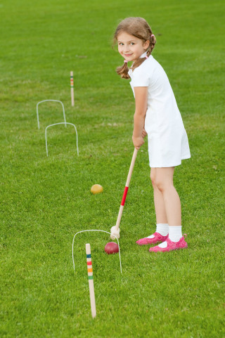 Girl hitting ball garden outdoors - a ball free wallpaper for mobile