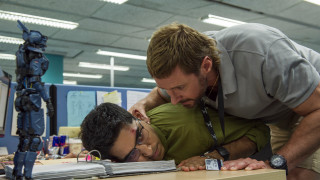 Man leaning green shirt robot - david annand free wallpaper