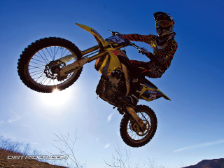 Dirt bike trick air hillside - action free wallpaper
