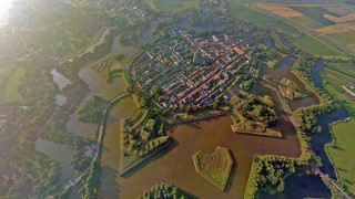 Birdseye city river green trees - aerial free wallpaper