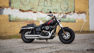 Motorcycle parked brick wall graffiti - dan scott free wallpaper