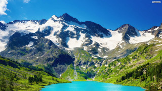 Mountain range lake blue sky 2 - a lake in the foreground free wallpaper