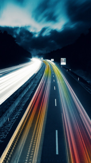 Long exposure highway traffic night - a cloudy sky free wallpaper for mobile
