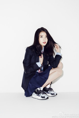 Woman suit crossed legs blue - free neon wallpaper