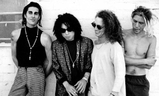 Young men group brick wall - a brick wall behind them free wallpaper