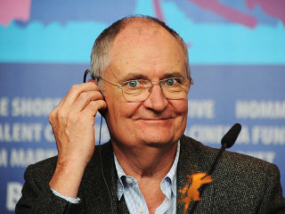 Man glasses microphone blue wall - dicky doyle free wallpaper