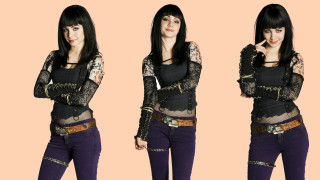 Woman black top purple pants 2 - her right hand free wallpaper