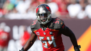 Football player red uniform running - his hand and a crowd free wallpaper