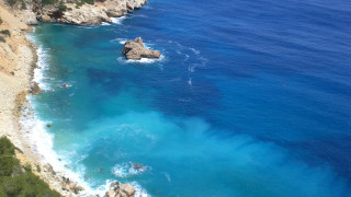 Beach cliff blue water rock - blue water free wallpaper