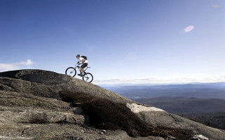 Man riding bike rocky mountain 3 - a bike free wallpaper