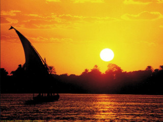 Sailboat sunset silhouette trees water - a sailboat free wallpaper