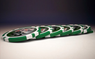 Green poker chips 3d render - a stack free wallpaper