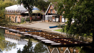 Canoes lined up water dock - a porch free wallpaper