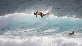 Surfing man wave ocean swimming - top of a surfboard in the ocean free wallpaper for desktop