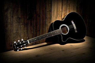 Guitar wooden table dark background - a guitar free wallpaper
