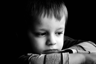 Young boy concerned looking over - a young boy free wallpaper
