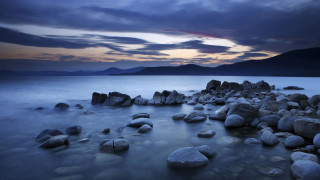 Rocky beach cloudy sky mountain - a mountain range in the distance free wallpaper