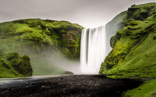 Waterfall black sand beach person - evaline ness free wallpaper