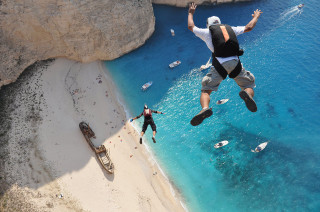 Man jumping cliff water boat - cliff childs free wallpaper