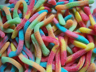Colorful candy worms white background - a table top free wallpaper