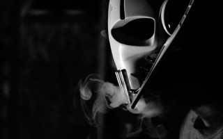Masked smoker dark room cigarette - their mouth free wallpaper