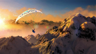 Parasailing mountain range sunset sky - over a mountain range free wallpaper