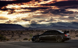 Car parked desert mountains clouds 2 - expressionism free wallpaper for desktop