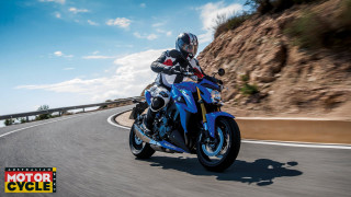Man riding blue motorcycle cliff - motion blur free wallpaper