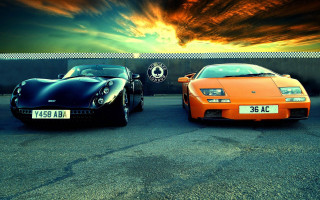 Sports cars parking lot sunset 2 - two sports car free wallpaper
