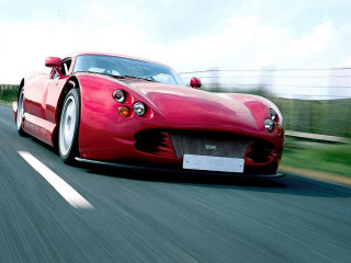 Red sports car driving road 11 - motion blur free wallpaper
