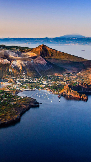 Lake mountains town blue sky - free landscape wallpaper for mobile