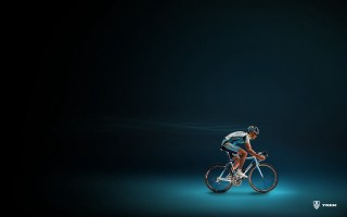 Man riding bike blue light 2 - eric deschamps free wallpaper
