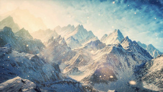 Snowy mountain range bright sun 2 - a snowy mountain range free wallpaper
