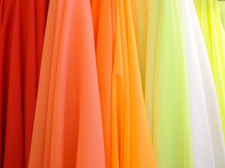 Colorful dresses hanging wall store - fluorescent free wallpaper