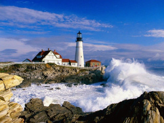 Lighthouse rocky shore crashing wave - a lighthouse free wallpaper