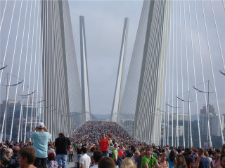 Crowd bridge water pillars skyline - a bridge over water free wallpaper