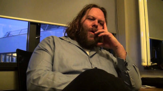 Man sitting chair hand mouth - erwin bowien free wallpaper