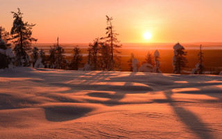 Sunset snowy landscape trees hills - the background and a person free wallpaper