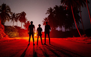 Night road palm trees fireworks - three person free wallpaper