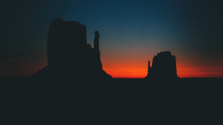 Sunset silhouette rock formation orange - distant free wallpaper for desktop