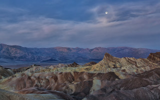 Mountain range moon clouds ocean - a view of a mountain range free wallpaper