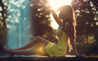 Woman yellow dress sitting backlit - a ledge free wallpaper for desktop