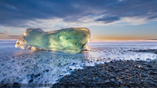 Iceberg beach sunset cloudy sky - a large iceberg free wallpaper