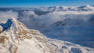 Mountain snowy clouds panorama beach - a view of a mountain range free wallpaper