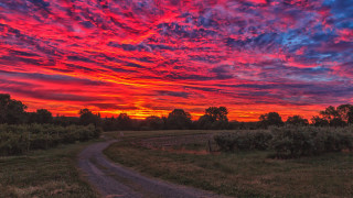 Sunset red blue dirt road - colorful cloud free wallpaper