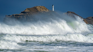 Lighthouse rock wave stormy sky - a lighthouse in the background free wallpaper