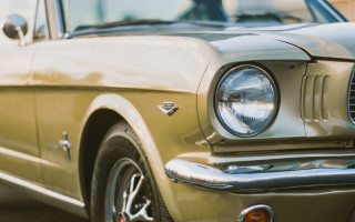 Car headlight building tiltshift photorealism - a close up of a car free wallpaper