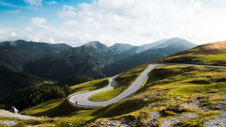 Winding road green hillside mountains - winding free wallpaper